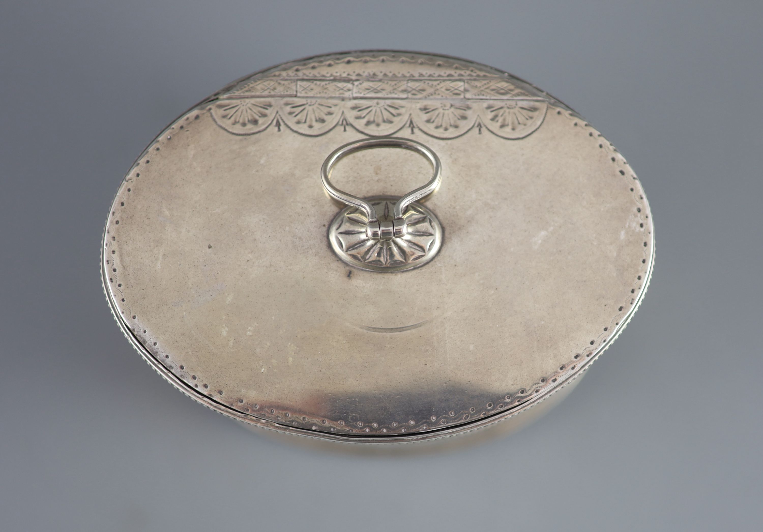 A George III silver oval tea caddy by John Younge & Co
